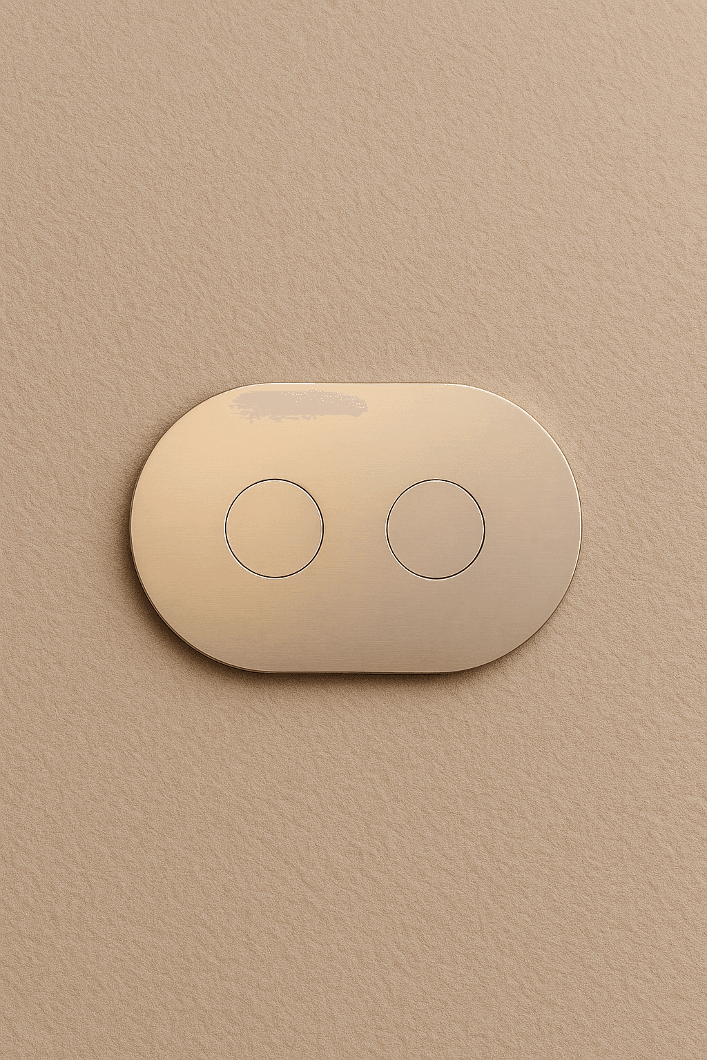 Brushed gold Lumira switch mounted flush against a beige wall