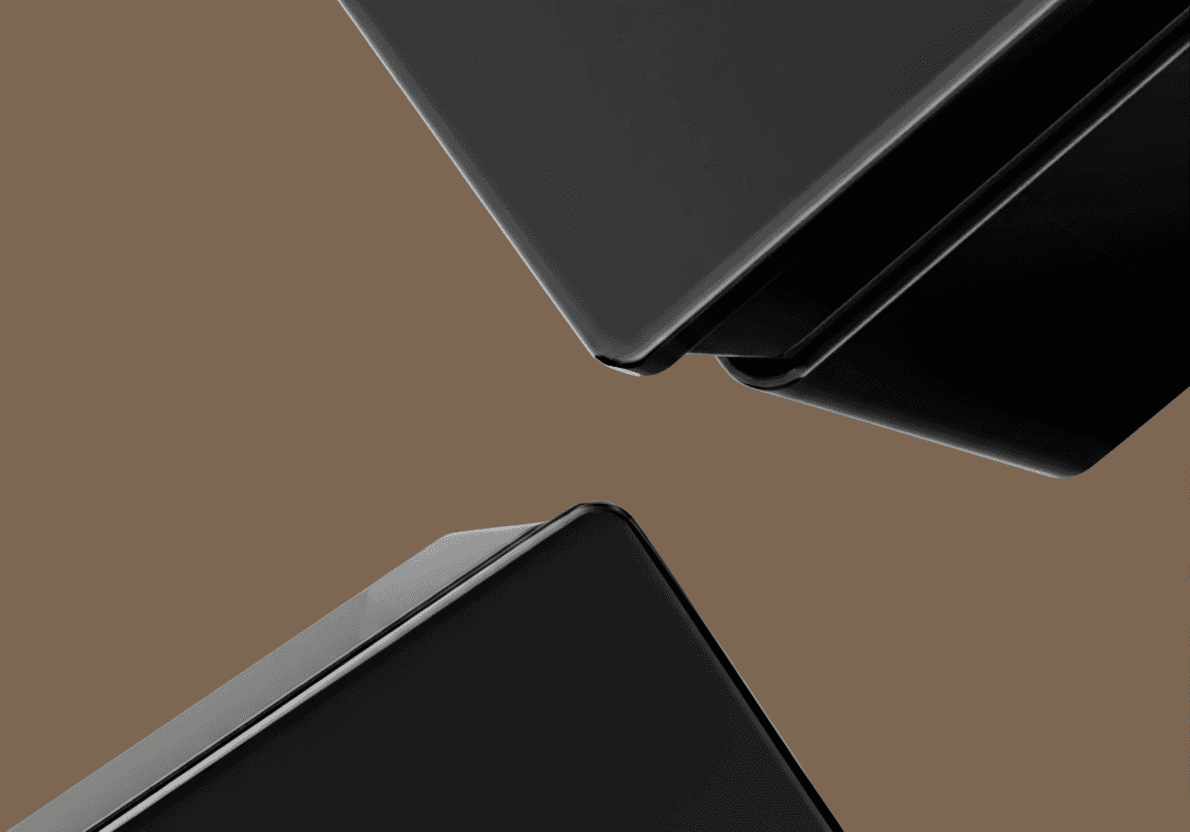 Glossy black Lumira switch plates showcasing their durable finish